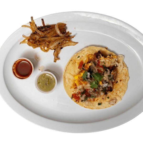 A Tacos El Primo taco with pico de gallo, cilantro, and cheese, served with grilled onions and two sauces.