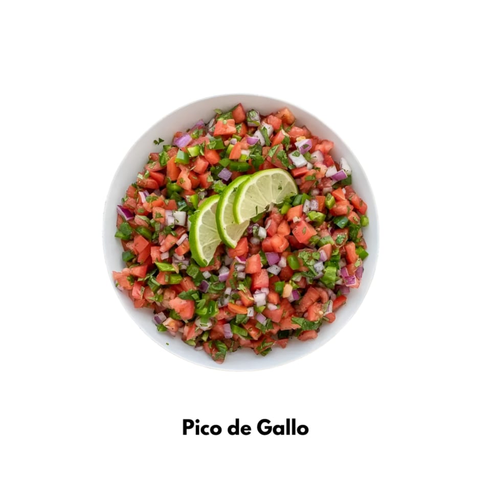 A white bowl filled with fresh Pico de Gallo, garnished with two lime slices.