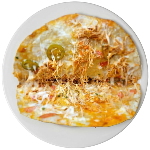 A chicken quesadilla from Tacos El Primo, topped with melted cheese, jalapeños, and pico de gallo.
